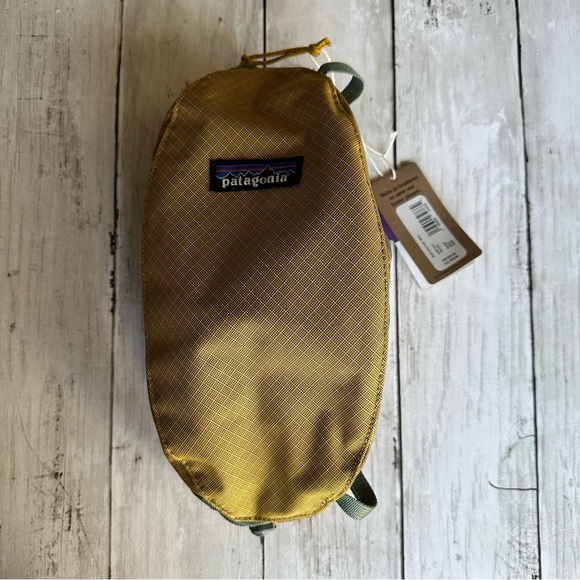 Patagonia Handbags - NEW WITH TAGS PATAGONIA SMALL CUBE CABIN GOLD COLOR. Stock# goat